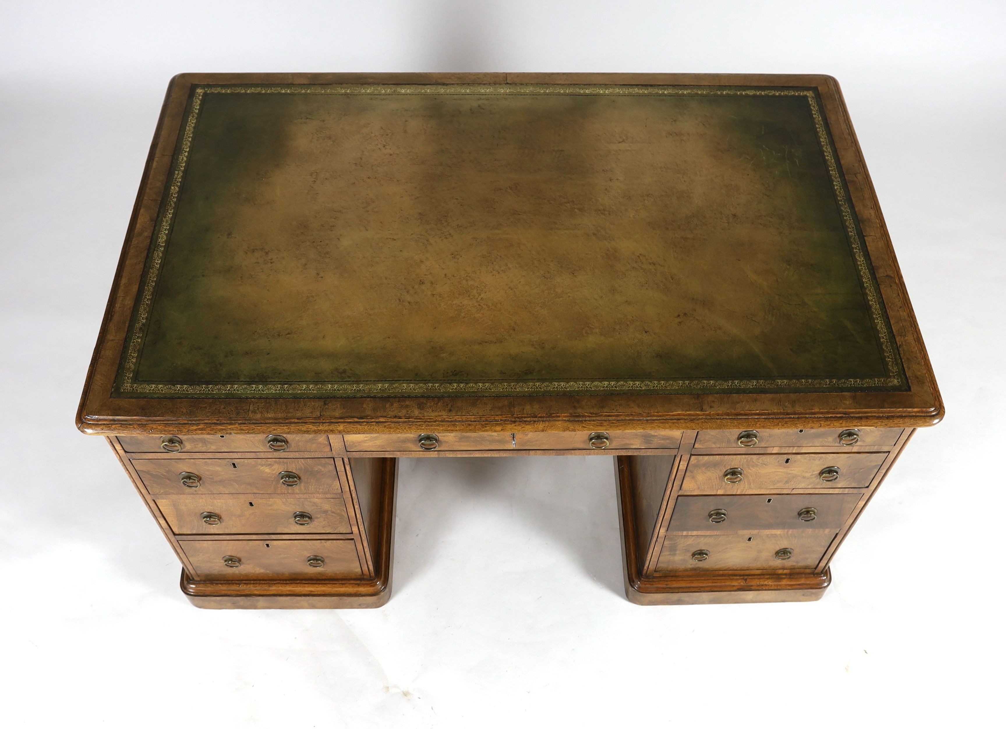 A late Victorian Gillow & Co. walnut pedestal desk, W.137cm D.85cm H.76cm